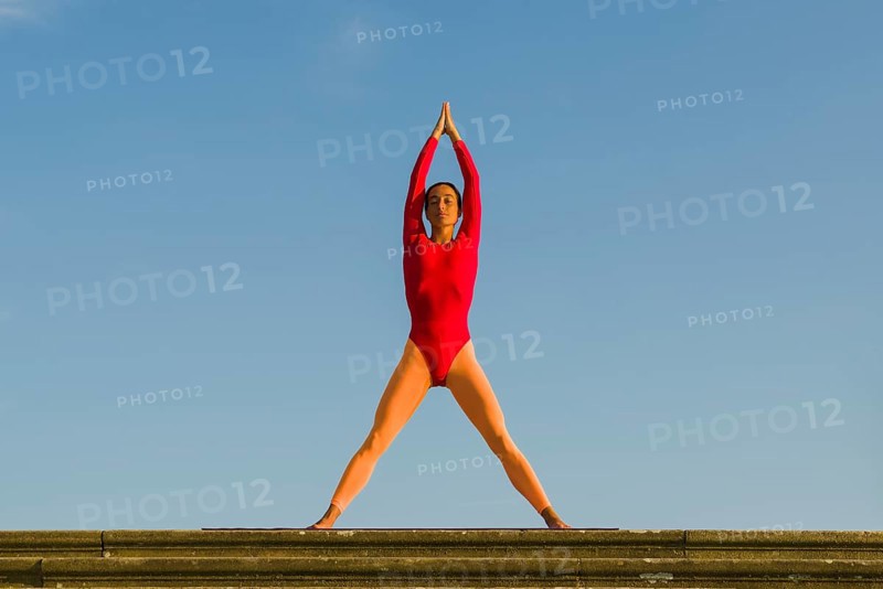 Young woman practising Hatha yoga