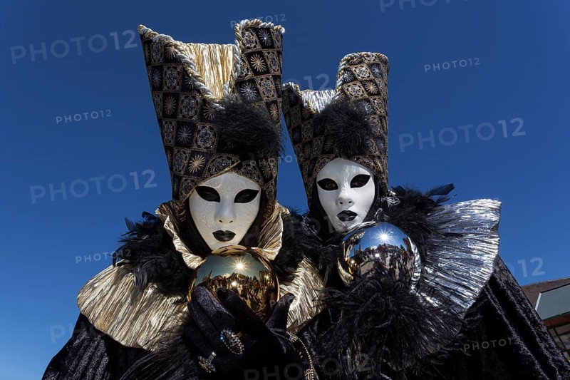 Venetian Carnival masks and costumes at the Venetian Fair on the historic market square