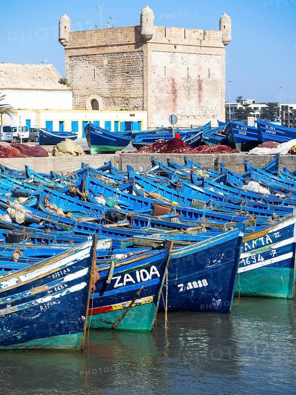 Old blue fishing boats in the port of Essaouira