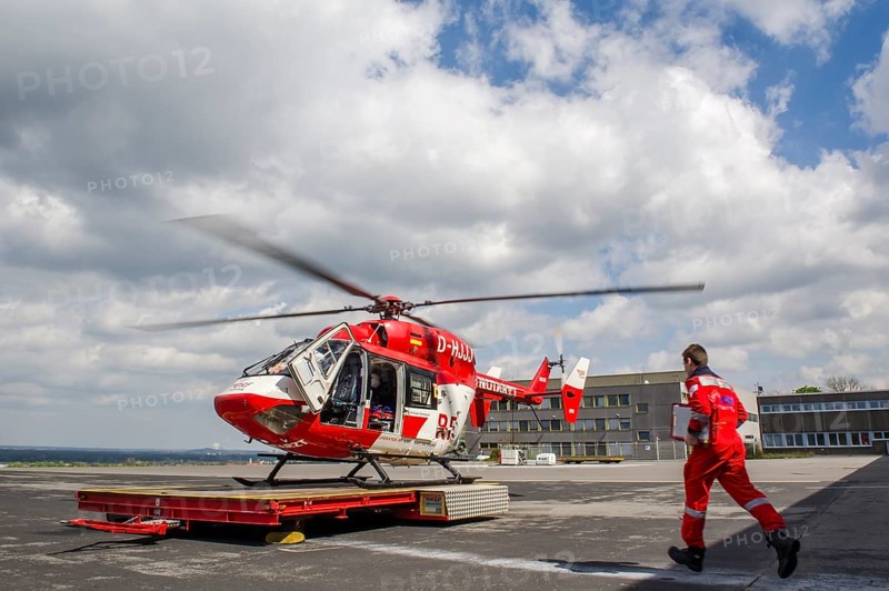 A paramedic running to a rescue helicopter of the DRF air rescue