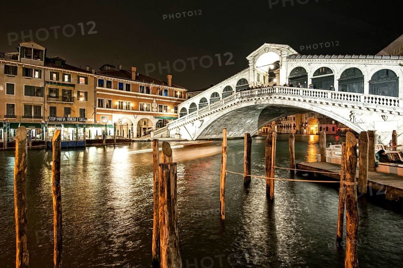 Dock on the Grand Canal at the Rialto bridge by night