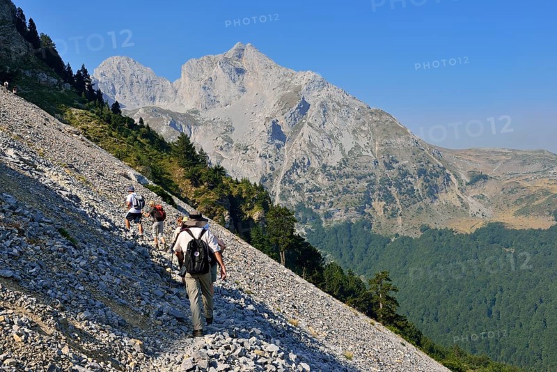 Group of hikers on a trail towards Kom Ljevorijecki