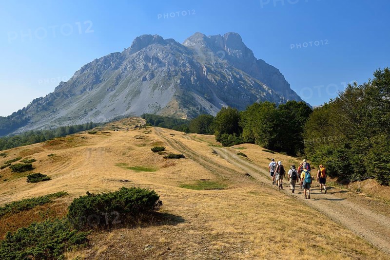 Group of hikers on a trail to Kom Vasojevicki