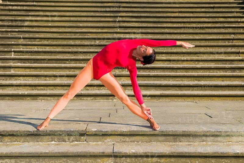 Young woman practising Hatha-Yoga outdoors