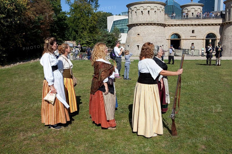 Women with with muzzle-loading rifles during live role-playing or ReenLarpment