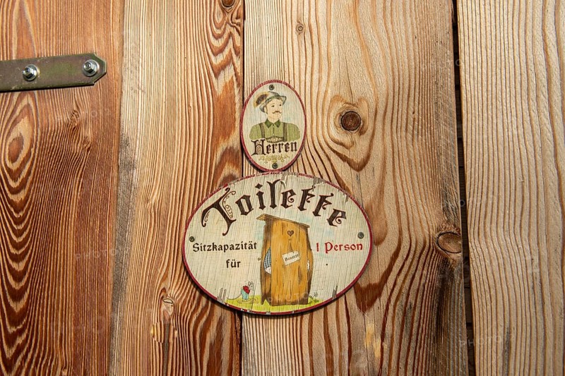 Sign toilet men at wooden door