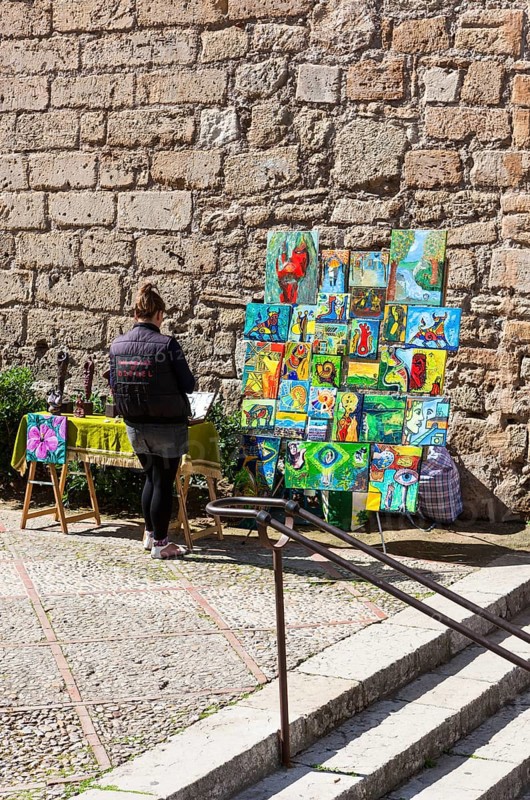 Street vendor selling paintings