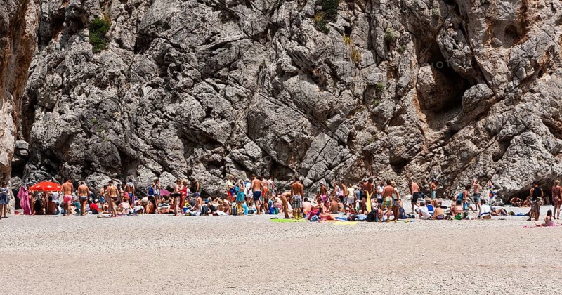 Tourists sunbathing in Torrent de Pareis Gorge