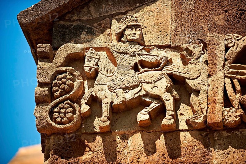 Bas-relief sculpture of a hunter in armour shooting an animal on the outside of the 10th century Armenian Orthodox Cathedral of the Holy Cross on Akdamar Island