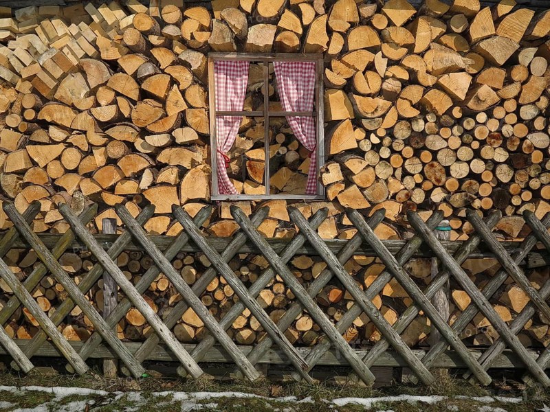 Fake windows in a stack of firewood