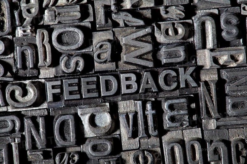 Old lead letters forming the word FEEDBACK