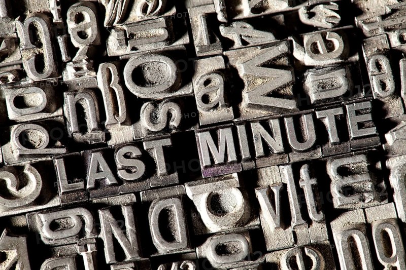Old lead letters forming the words 'LAST MINUTE'