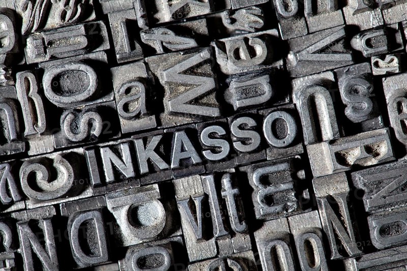Old lead letters forming the word 'INKASSO'