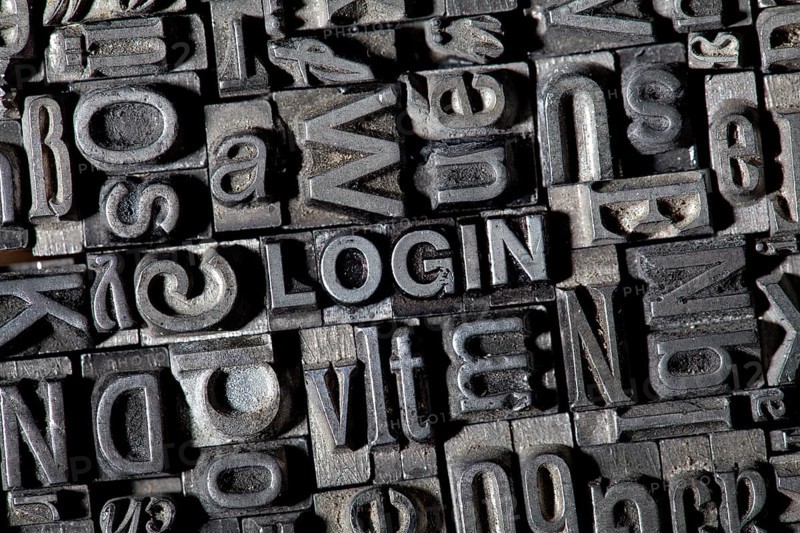 Old lead letters forming the word "LOGIN"