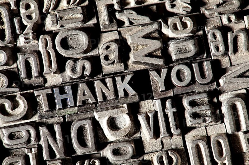Old lead letters forming the phrase THANK YOU
