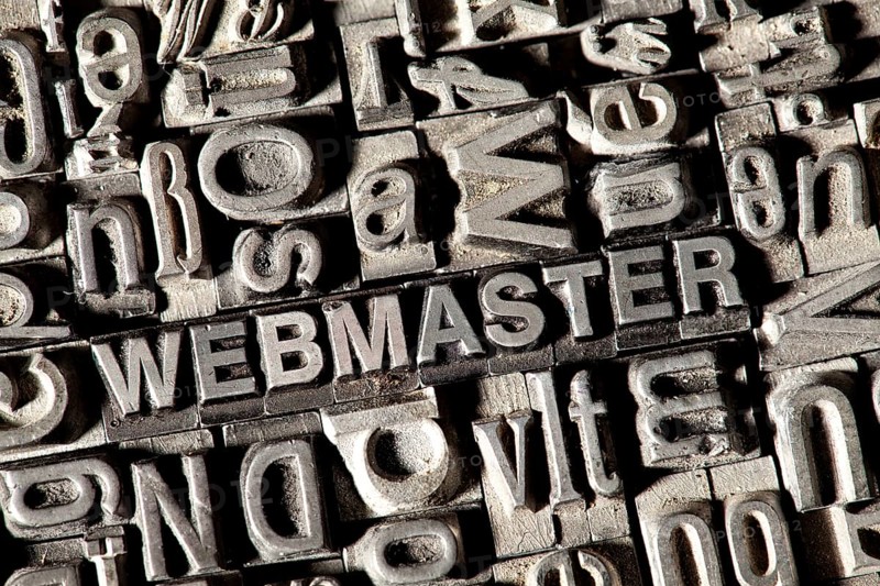Old lead letters forming the word WEBMASTER