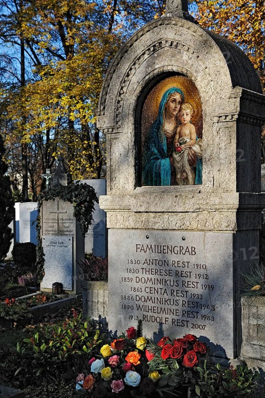 Family grave with mosaic and roses on the Ostfriedhof or East Cemetery