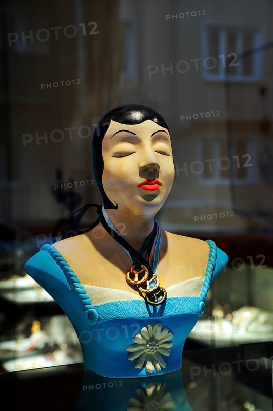 Bust wearing jewellery pendants