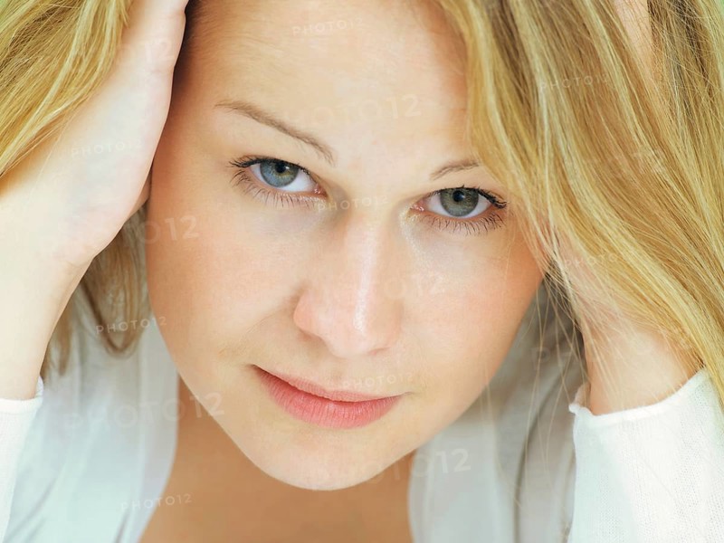 Portrait of a young woman with a serious face