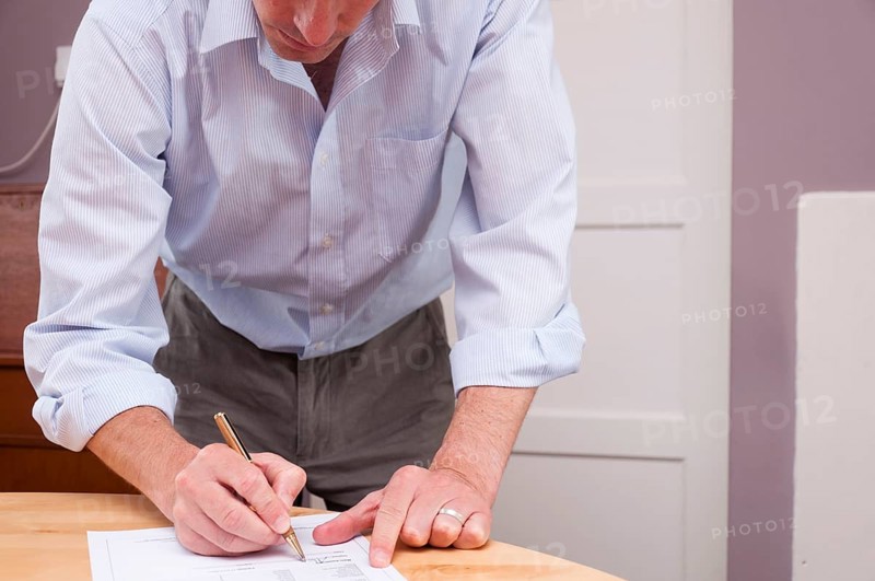 Man signing contract