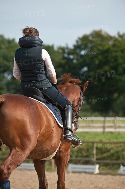 Woman riding a horse
