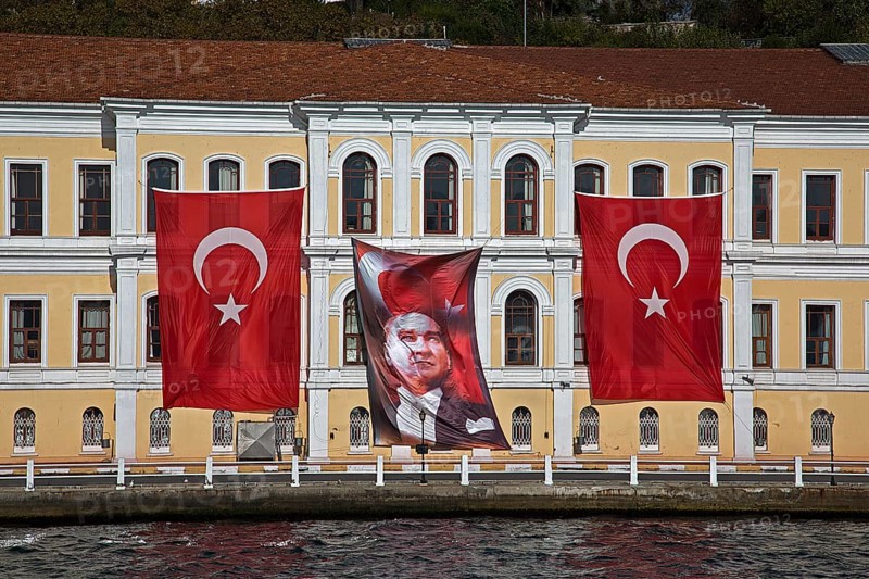 Flags of Musatafa Kemal Ataturk and Turkey flying on a building in honour of the anniversary of his death on 10 November 1938