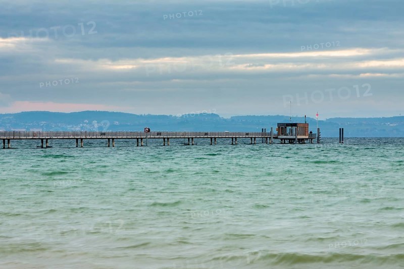 The pier at sunrise in Altnau on Lake Constance