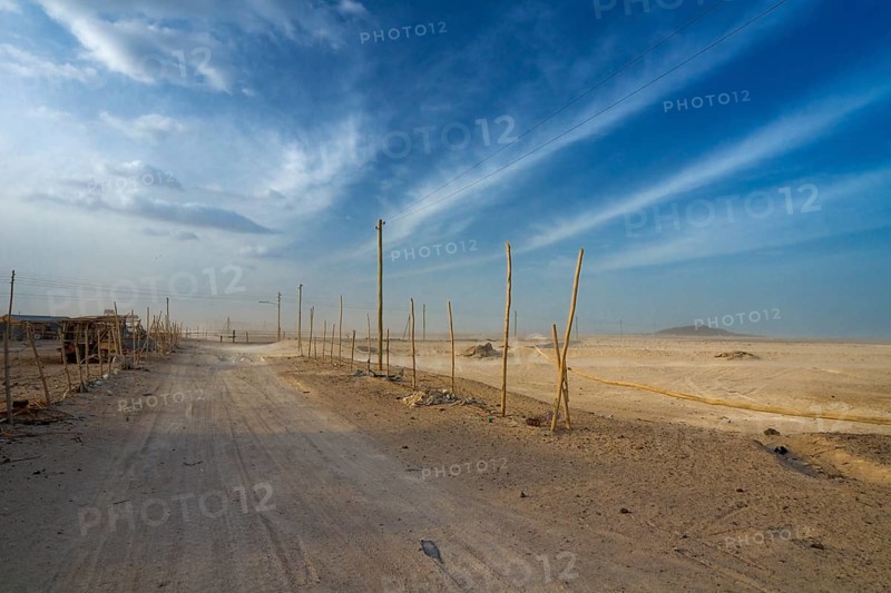 Main road of the salt workers settlement at Afdera during a sandstorm