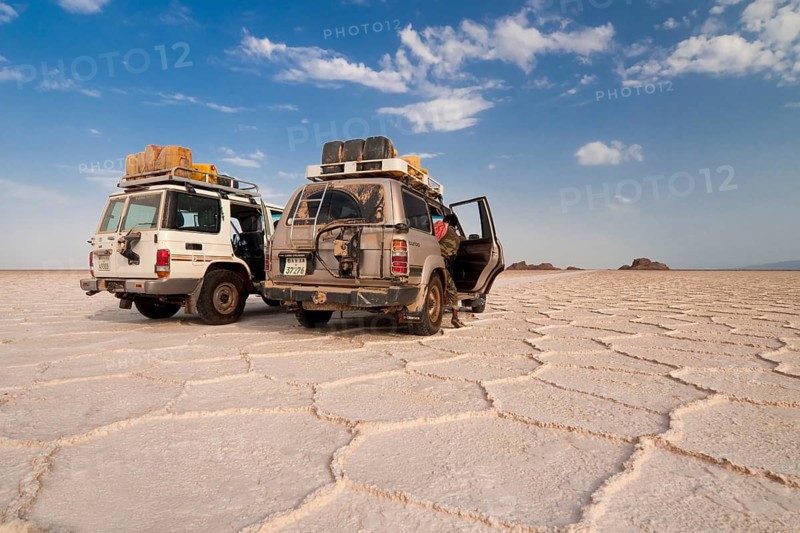 SUVs parked on the salt formations of the Ass Ale salt lake in the Danakil Depression