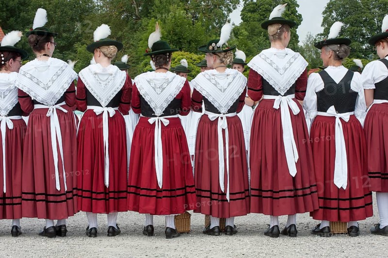 Women in traditional Bavarian costume forming a guard of honour for the entrance into the beer tent