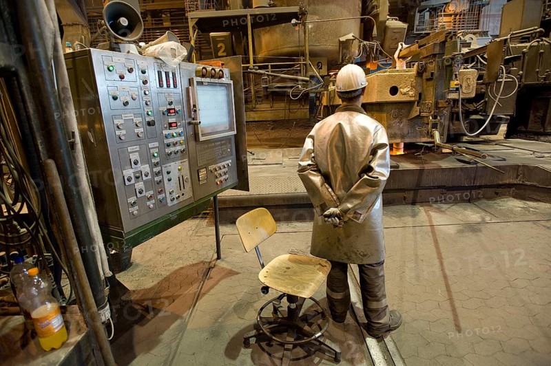 Liquid steel pouring from the ladle into the casting