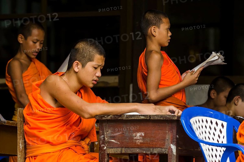 Buddhist monks being taught in a monastery school