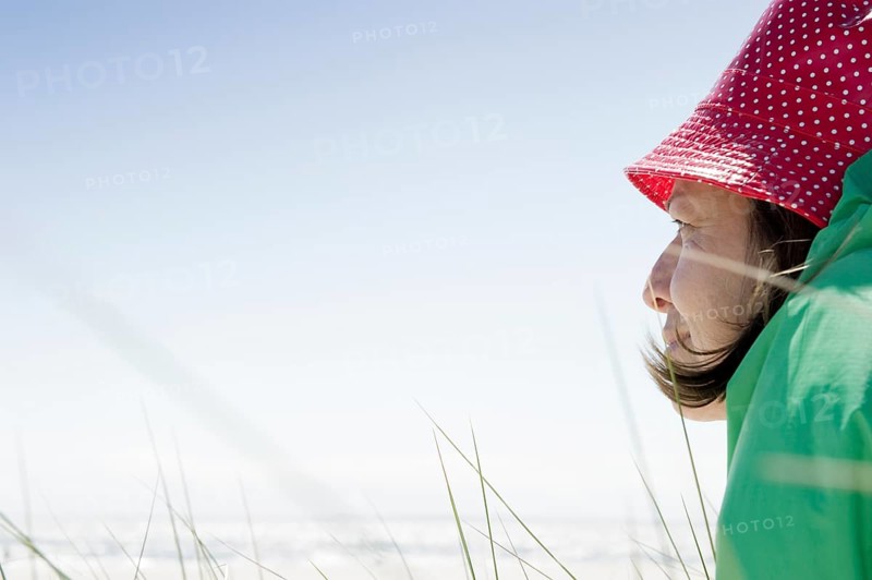 A woman sitting on the beach