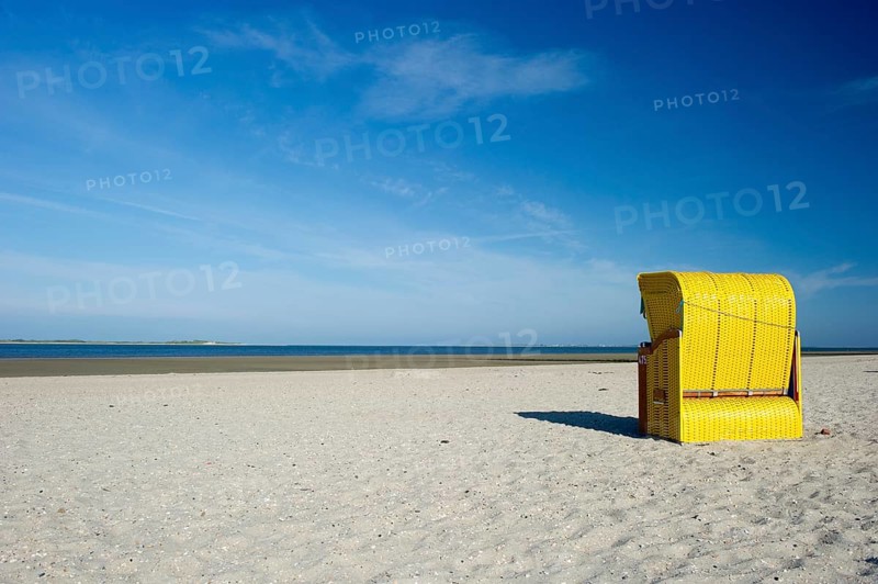 Yellow roofed wicker beach chairs on the beach near Utersum
