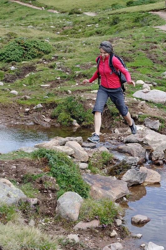 Hiker at the Raschotz or Rasciesa mountain pasture near St. Ulrich