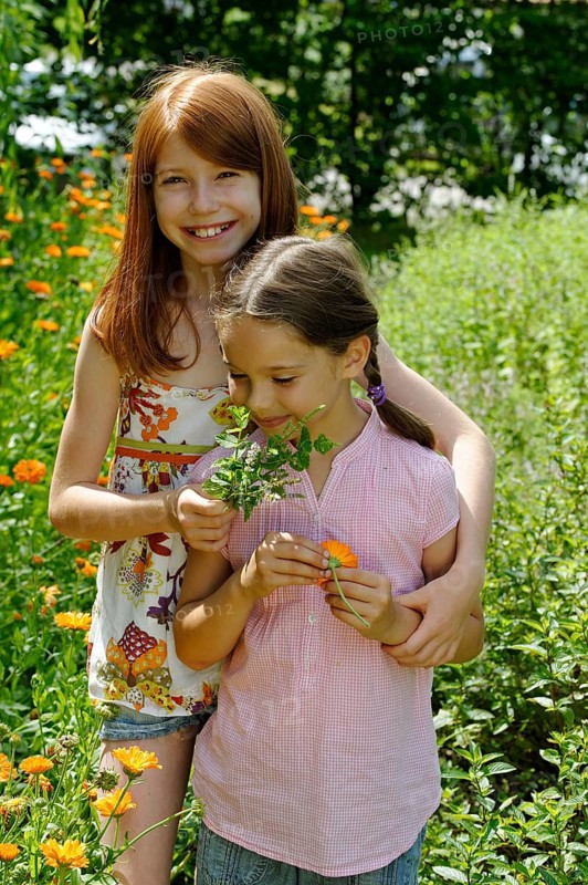 Girls in a meadow of marigolds