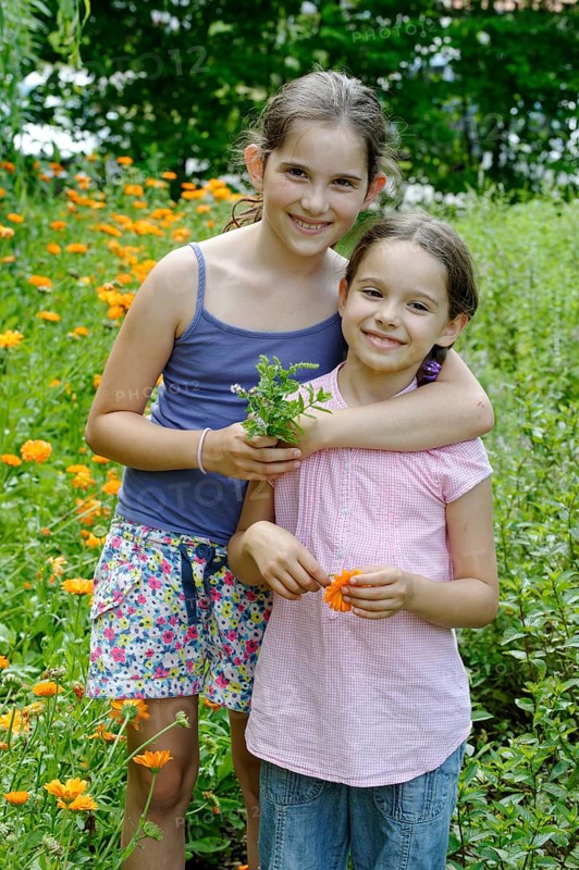 Girls in a meadow of marigolds