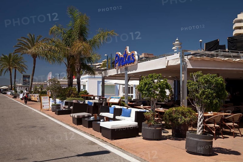 Restaurant and palm trees on the promenade