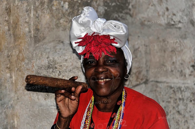 Cuban woman holding a cigar