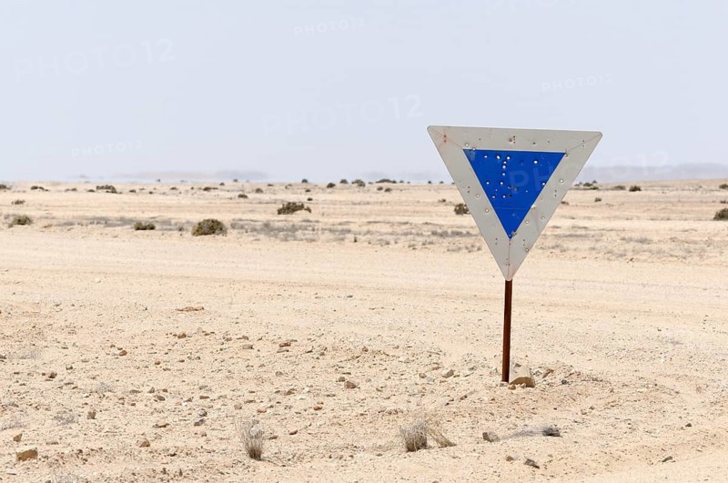 Weathered road sign