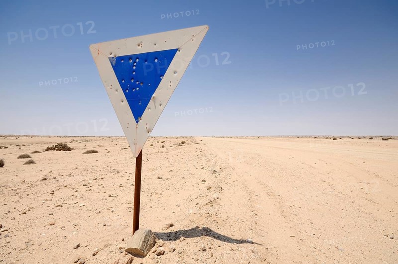Weathered road sign