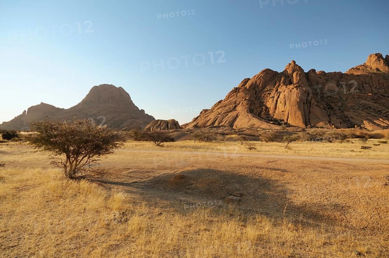 Savannah landscape with granite rocks of Spitzkoppe Mountain and the Pontok Mountains