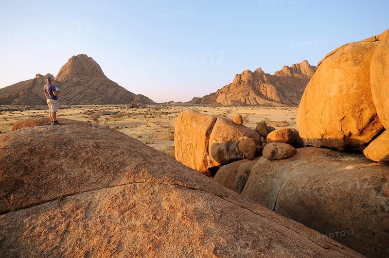 Savannah landscape in the evening sun with rock formations