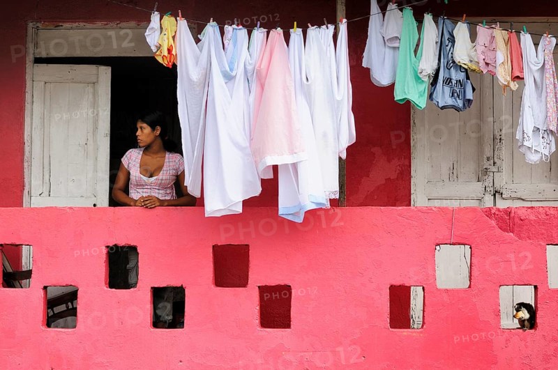 Woman next to washing on the line