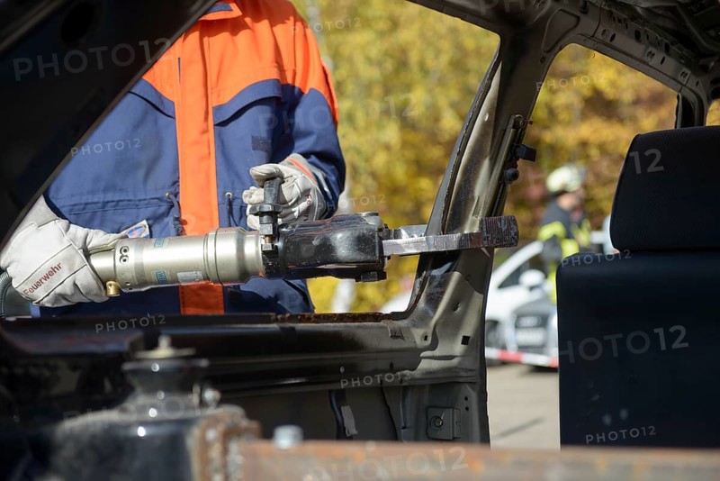 Firefighter working with hydraulic rescue equipment
