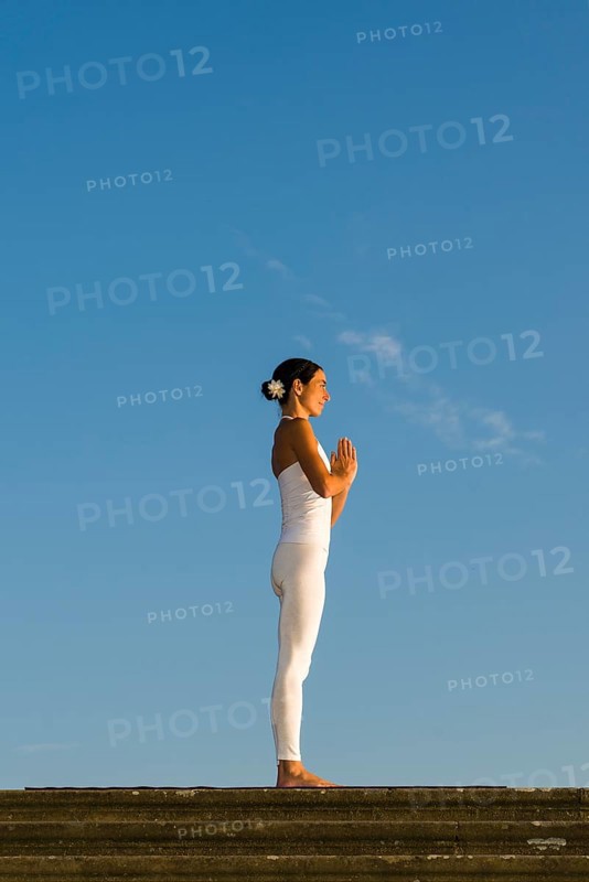 Young woman practising Hatha yoga
