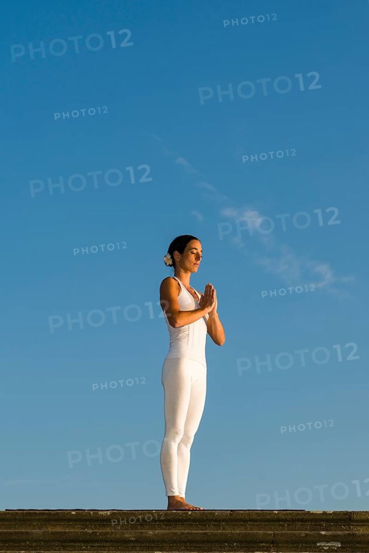 Young woman practising Hatha yoga