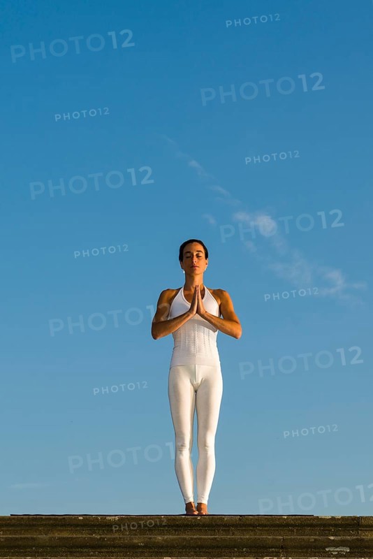 Young woman practising Hatha yoga