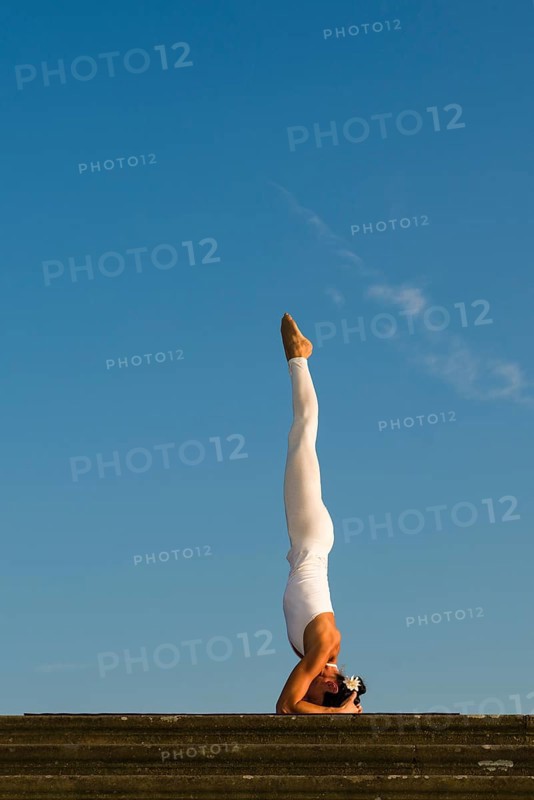 Young woman practising Hatha yoga