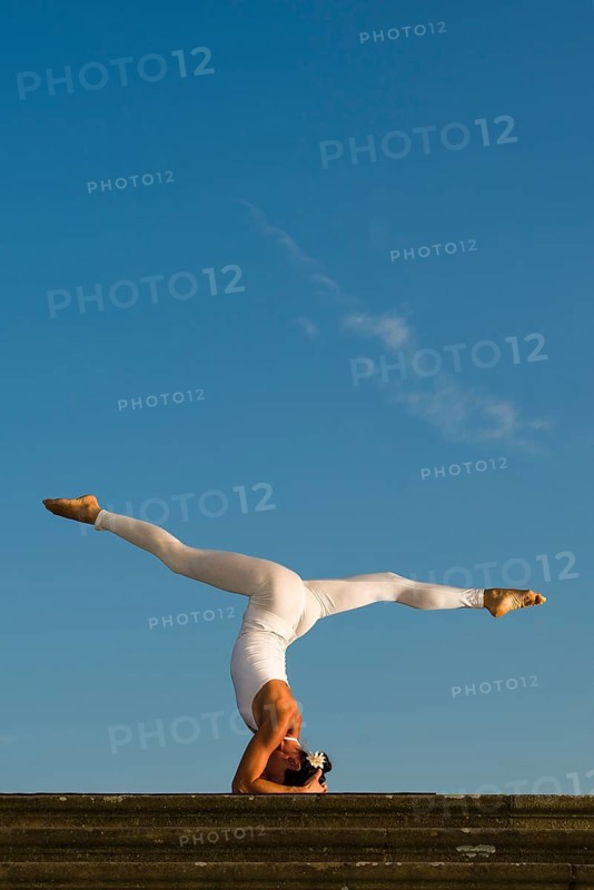 Young woman practising Hatha yoga